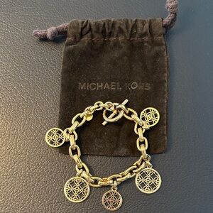 Michael Kors Gold Charm Bracelet with Intricate Discs